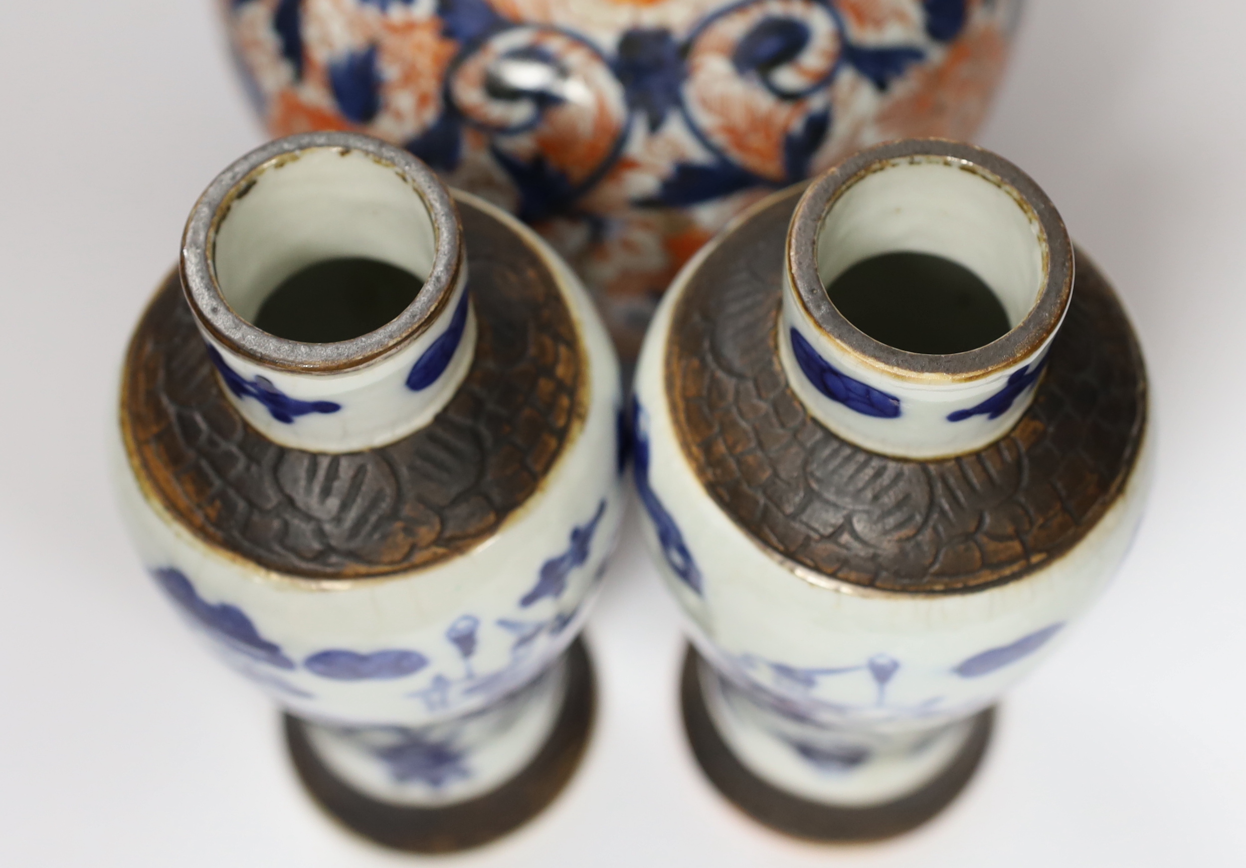 A pair of Chinese blue and white crackleware vases and covers and an Imari vase and cover, largest 31cm high